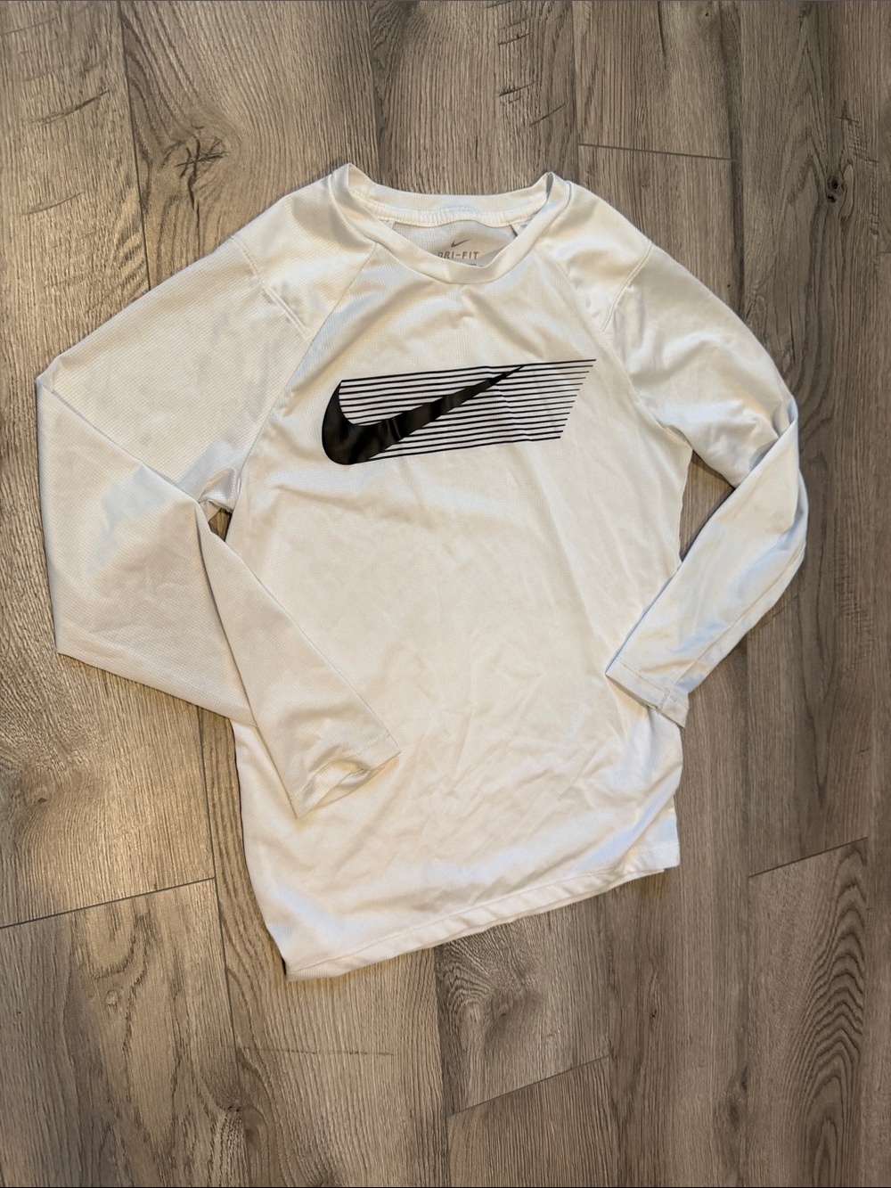 Nike White Long Sleeve Top with Black Swoosh Graphic